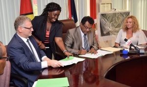 Minister of Public Security, Khemraj Ramjattan signing the MoU with Ambassador of the European Union, Jernej Videtič for the implementation of the Seaport Cooperation Programme (SEACOP) in Guyana 