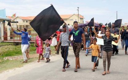 Dead child’s parents, relatives stage protest