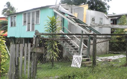 Retrieve residents repair storm-damaged homes