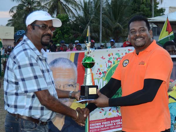 https://www.kaieteurnewsonline.com/images/2017/08/Roy-Jaferally-his-Man-of-the-Finals-Trophy-from-Mohamed-Panchu-of-KSM-Investment.jpg