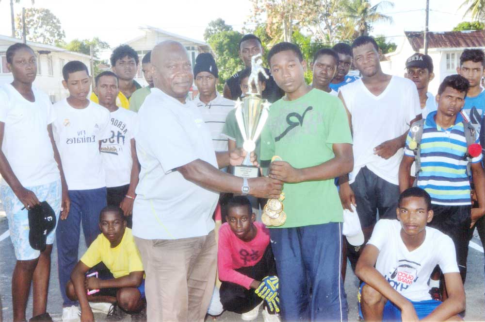 https://www.kaieteurnewsonline.com/images/2017/09/Tucville-Secondary-skipper-collects-the-winner%E2%80%99s-trophy-from-James-Lewis-after-their-victory..jpg
