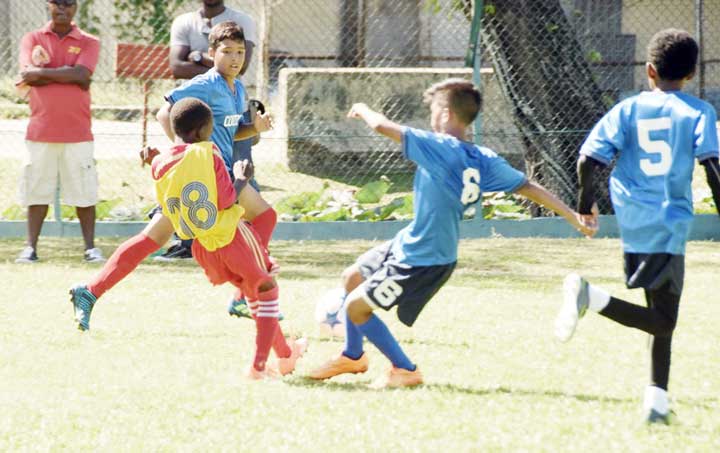 https://www.kaieteurnewsonline.com/images/2017/10/Marian-Academy-Micheal-Alphonso-during-one-of-his-many-challanges-against-St.-Agnes-player-in-his-teams-combative-penalty-win-on-saturday.jpg