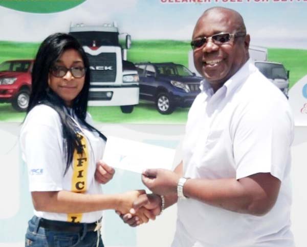 https://www.kaieteurnewsonline.com/images/2017/10/Surica-Singh-of-GMRSC-collects-Guyoil%E2%80%99s-sponsorship-for-the-International-Race-of-Champions-from-Marketing-Manager-Eric-Whaul-copy.jpg