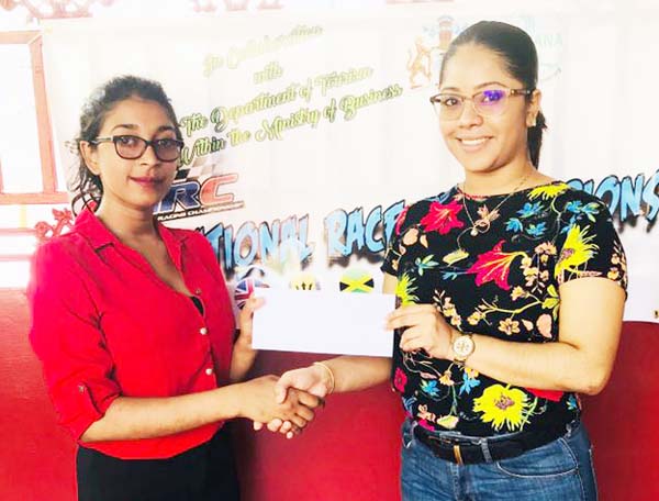 https://www.kaieteurnewsonline.com/images/2017/11/Sasha-Lewis-of-Palm-Court-hands-over-sponsorship-to-GMRSC%E2%80%99s-Surica-Singh-for-the-upcoming-International-Race-of-Champions.jpg