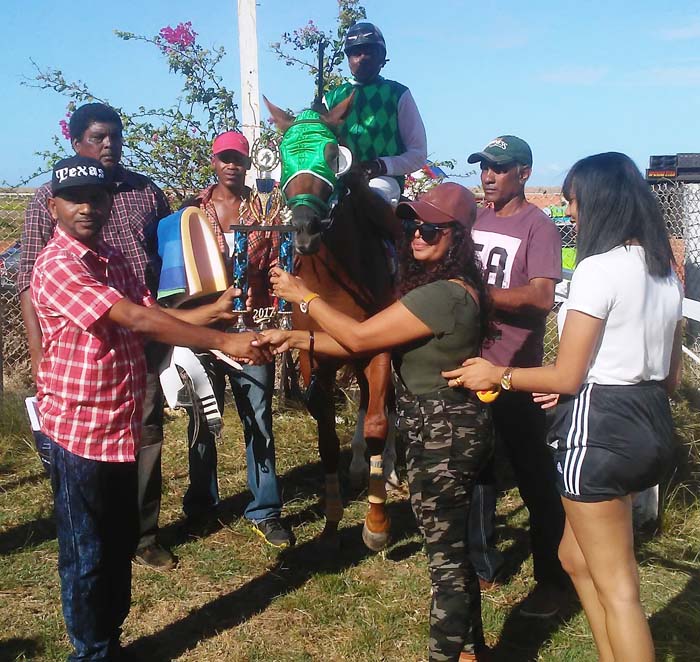 https://www.kaieteurnewsonline.com/images/2017/11/Shanti-Persaud-receiving-the-winning-trophy-after-King-Stanley-defeated-Slim-Shady-in-the-K-Class-race..jpg