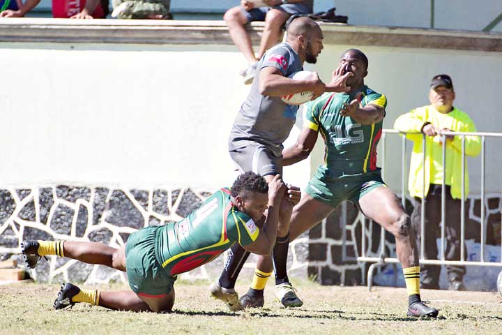 https://www.kaieteurnewsonline.com/images/2017/11/The-Green-Machine-double-teaming-this-Bermudian-player-yesterday..jpg