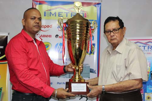 https://www.kaieteurnewsonline.com/images/2017/12/Ariff-Baksh-of-Metro-presents-the-trophy-to-Justice-Cecil-Kennard-copy.jpg