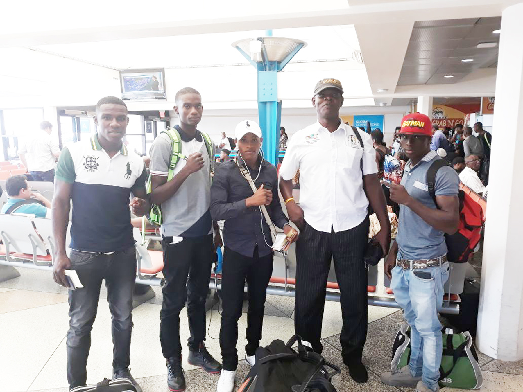 https://www.kaieteurnewsonline.com/images/2017/12/Coach-Terrence-Poole-and-his-boxers-at-Grantley-Adams-Airport-copy.jpg