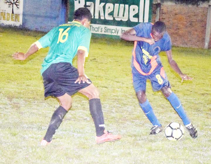 https://www.kaieteurnewsonline.com/images/2017/12/Milerocks-Lennox-Richard-16-prepares-to-challenges-Wycliffe-Simon-of-Den-Amstel-for-possession-during-his-teams-2-1-victory-at-the-MSC-ground-on-Christmas-night.jpg