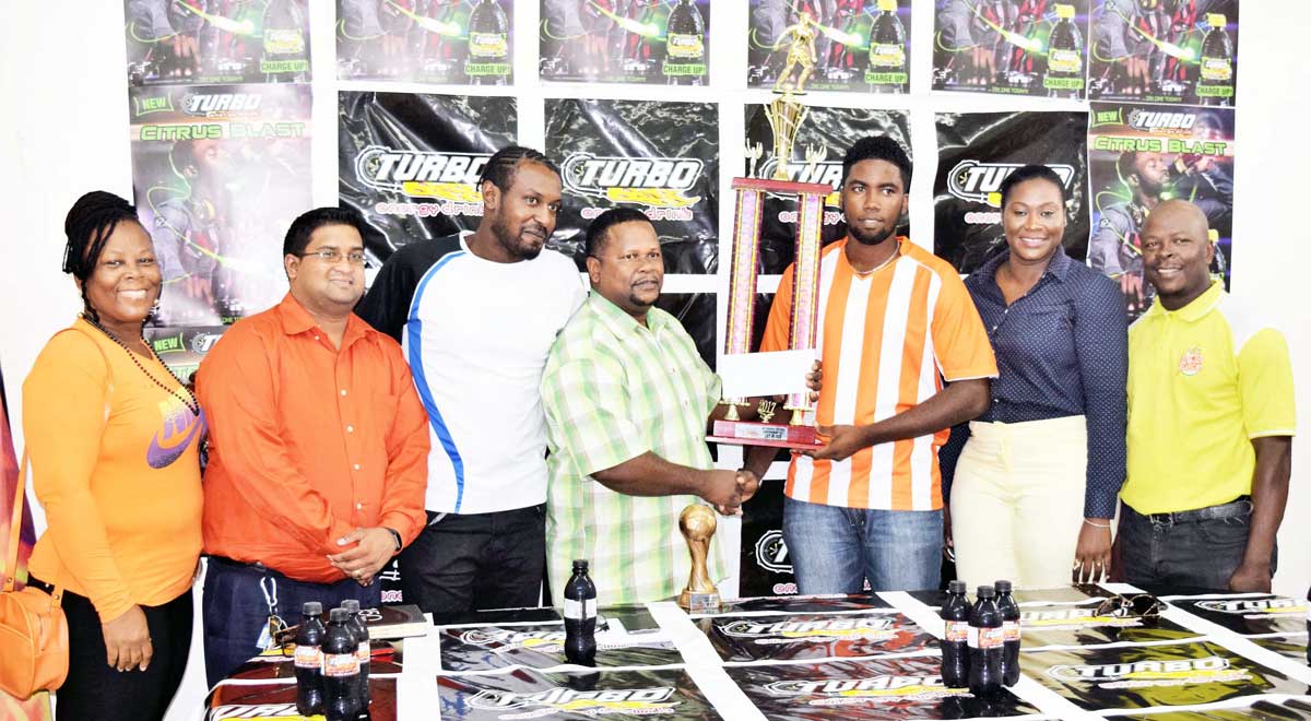 https://www.kaieteurnewsonline.com/images/2017/12/Turbo-manager-Samuel-Arjune-Center-hands-over-the-Cship-trophy-and-500000-cheque-to-Camptown-FC-captain-Lezhan-Lord-with-MVP-Richie-Richardson-3rd-from-left-flanks-him.jpg
