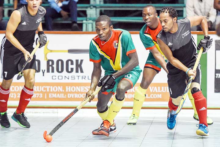 https://www.kaieteurnewsonline.com/images/2018/01/Action-between-Guyana-and-TT-during-the-Pan-Am-Indoor-Hockey-Cups-at-CASH-last-October.-Jamarj-Assanah-center-being-flanked-by-2-TT-players.jpg