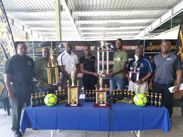 https://www.kaieteurnewsonline.com/images/2018/01/Colours-Boutique-rep-Creanna-Damon-Centre-left-hands-over-the-championship-trophy-to-organiser-Travis-Bess-in-the-presence-of-Banks-DIH-reps-and-other-organisers-during-yesterday%E2%80%99s-launch.jpg
