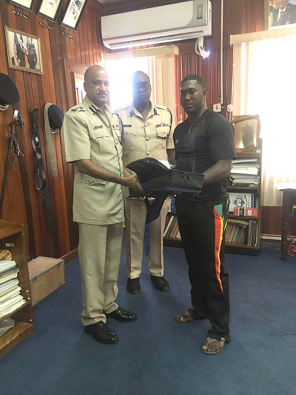 https://www.kaieteurnewsonline.com/images/2018/01/Commissioner-Seelall-Persaud-hands-over-the-gear-to-Ricardo-Adams-in-the-presence-of-Assistant-Commissioner-Nigel-Hoppie-DSM..jpg