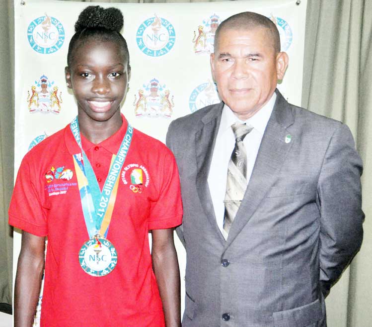 https://www.kaieteurnewsonline.com/images/2018/01/Deshawna-Skeete-and-Dr.-Norton-share-a-photo-at-the-Sport-Ministrys-boardroom-upon-her-return-from-South-America-Youth-Games.jpg