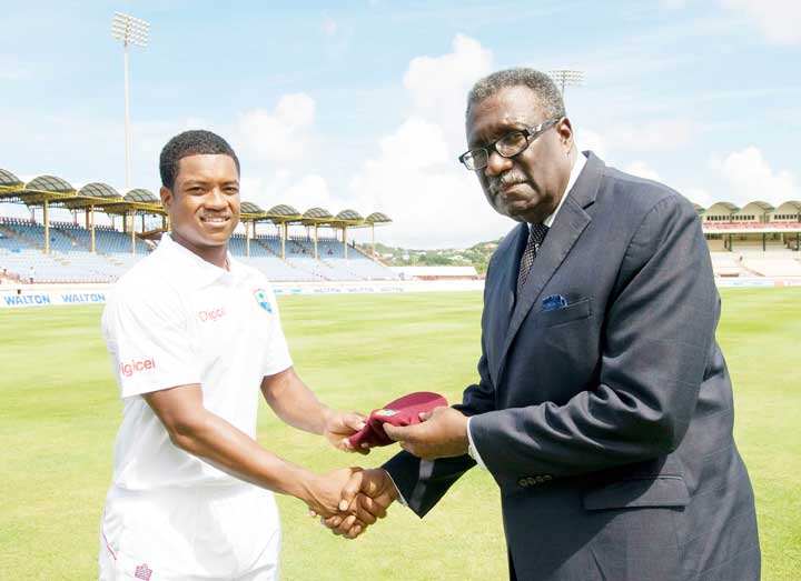 https://www.kaieteurnewsonline.com/images/2018/01/Johnson-receives-his-Test-cap-from-the-Legendary-West-Indies-Captain-Clive-Lloyd.jpg
