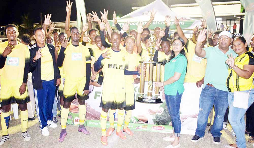 https://www.kaieteurnewsonline.com/images/2018/01/Milo-Brand-Manager-Renita-Sital-hands-over-the-winning-trophy-to-Chase-Academy%E2%80%99s-captain-Kelsey-Benjamin-in-the-presence-of-teammates-on-April-9th-last-year.jpg