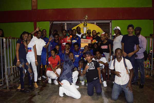 https://www.kaieteurnewsonline.com/images/2018/02/Champions-of-the-Inaugural-Magnum-Mash-Cup-Futsal-competition-pose-with-their-tropy-while-being-flocked-by-member-of-the-organiser-Legacy-and-Ansa-Mcal-along-with-fans.jpg
