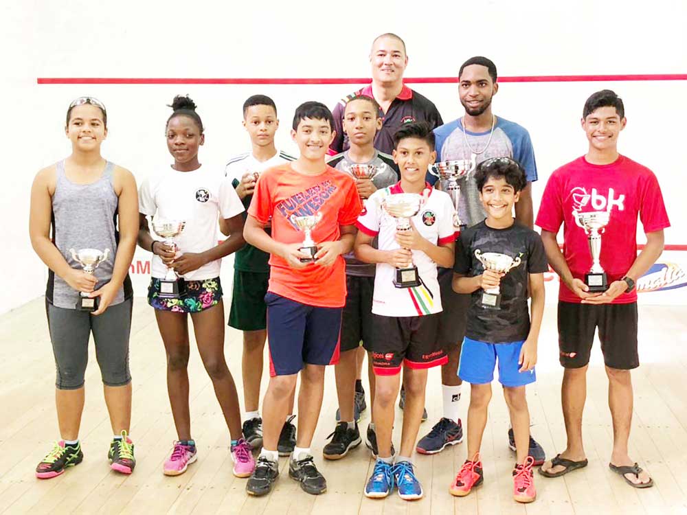 https://www.kaieteurnewsonline.com/images/2018/02/Some-of-the-winners-in-the-Bounty-Farm-Handicap-squad-tournament-share-a-photo-with-their-accolades-after-yesterdays-finals-at-Georgetown-Club-Squash-Courts.jpg