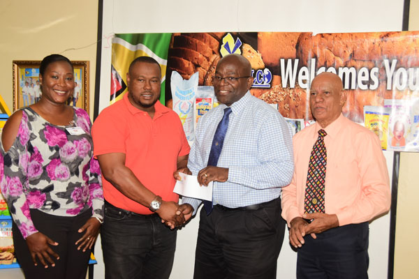 https://www.kaieteurnewsonline.com/images/2018/02/Troy-Mendonca-2nd-left-receives-the-sponsorship-cheque-from-NAMILCO%E2%80%99s-Fitzroy-McLeod-in-the-presence-of-the-company%E2%80%99s-1.jpg