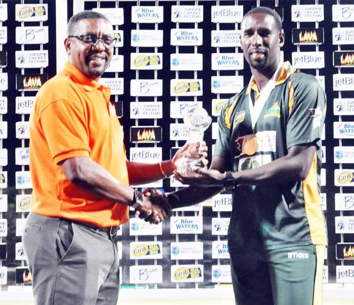 https://www.kaieteurnewsonline.com/images/2018/02/Volcanoes-Captain-Shane-Shillingford-collects-the-Clive-Lloyd-Trophy-from-CWI-President-Dave-Cameron-Sean-Devers-photo.jpg