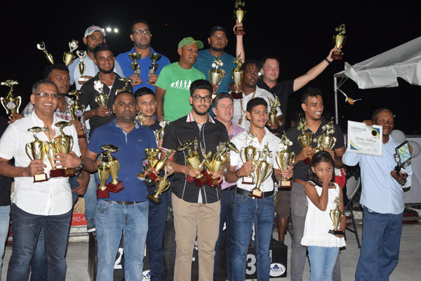 https://www.kaieteurnewsonline.com/images/2018/03/A-group-of-the-top-motor-racers-from-Sundays-National-Race-of-Champions-pose-with-their-accolades-on-Monday-Night-at-GMRSCs-office.jpg