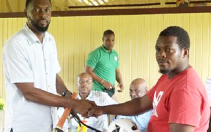 Baracara residents get Sports gear, books from Government