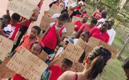 Kwakwani residents hold a vigil for murdered midwife