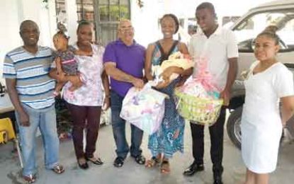 Promise Kept! REO Dennis Jaikarran delivers Christmas hampers to Wakenaam babies