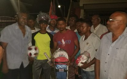 Minister Khemraj Ramjattan and team presents sports gear to No72 Sports Club