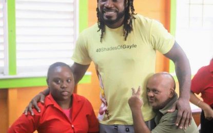 Chris Gayle donates cash for Ipads at special needs school