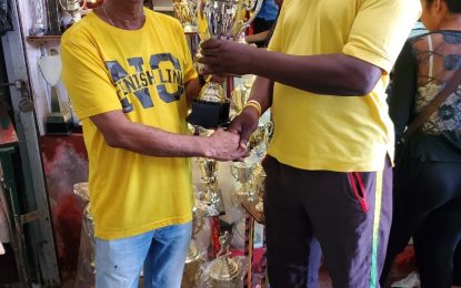 Trophy on board with Terrence Ali boxing