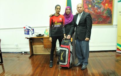 Minister Norton presents gears to young cricketer