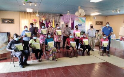 Food for the Poor & St. Francis’ NGO hands over home ownership certificates to 10 families.