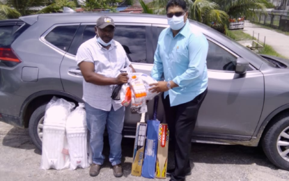 Beharry supports Pomeroon youths with cricket gear