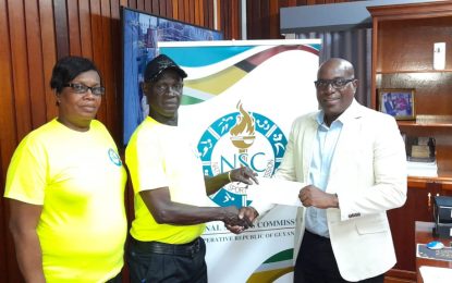 Director of Sports hands over NSC prize for Domino champs