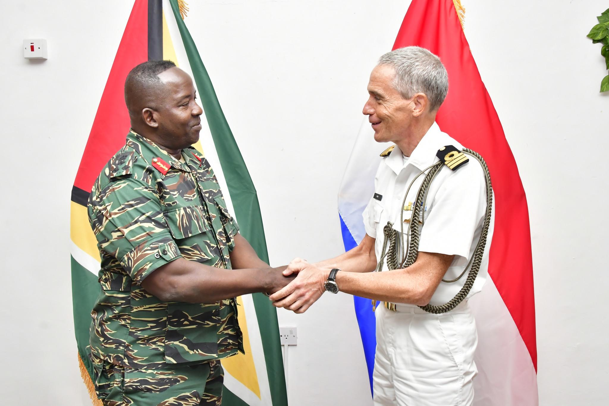 Chief of Staff of the Guyana Defence Force, Brigadier Godfrey Bess greets Commander (Navy) Geordie Klein, the Kingdom of the Netherlands’ Defence Attaché for Suriname and Guyana (Photo courtesy of the Guyana Defence Force)
