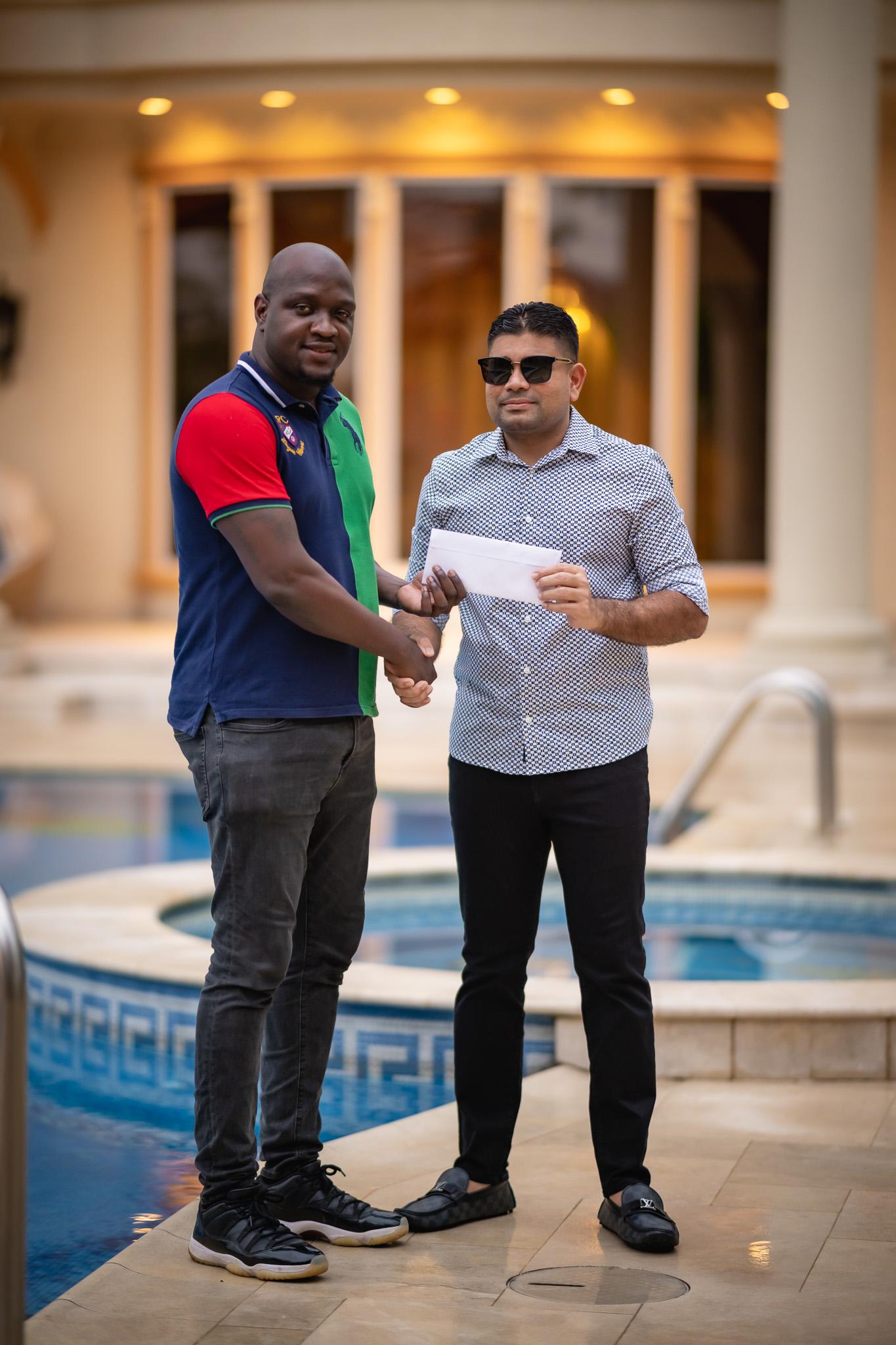 Team Mohamed’s principal, Azruddin Mohamed, presenting his entity’s support to 3x3 Classic to organiser Rawle Toney.