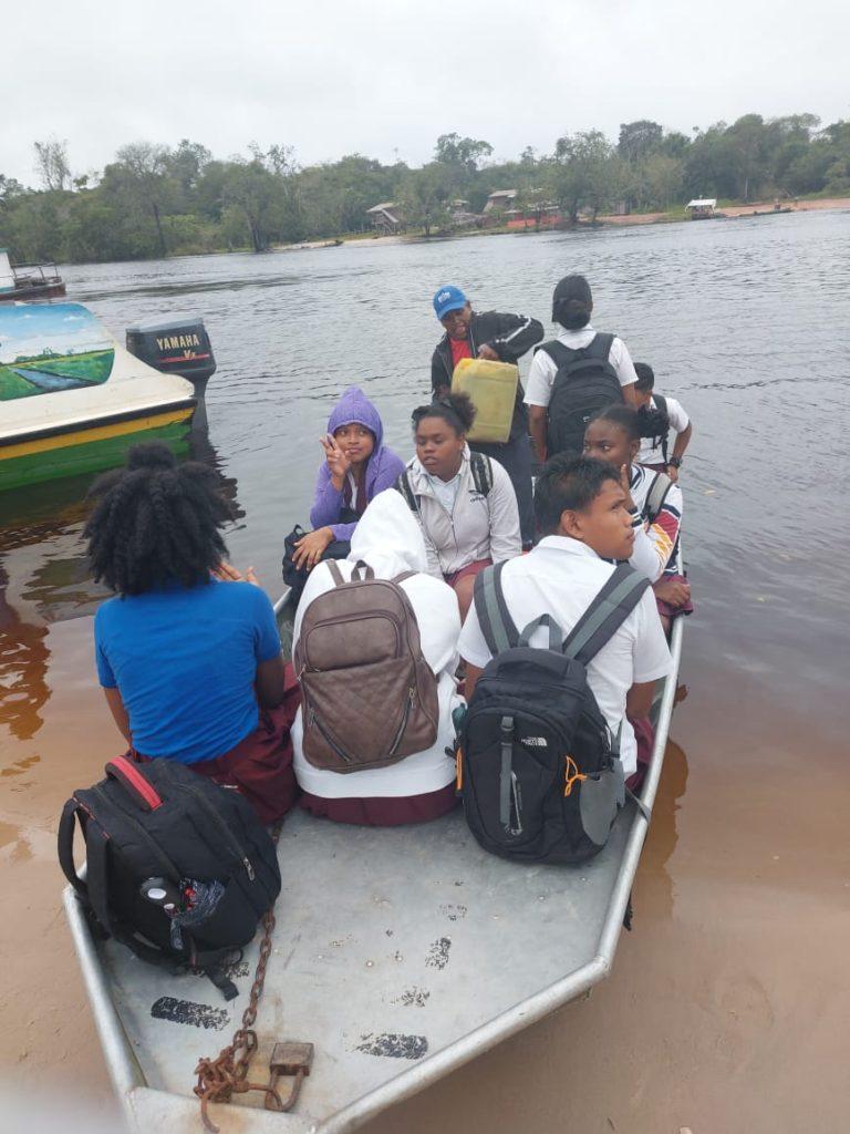 Students being transported without life jackets in a speed boat