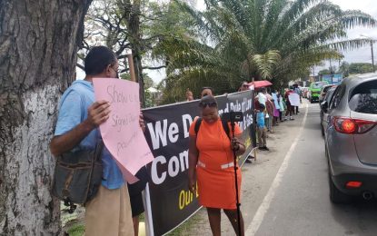 Women take to the streets to have full liability coverage from Exxon