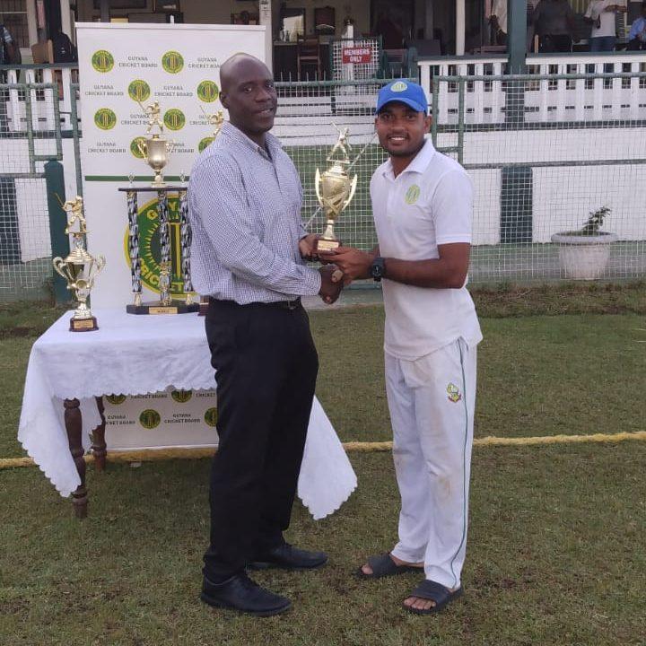 Richie Looknauth receives his award for most wickets in the tournament.