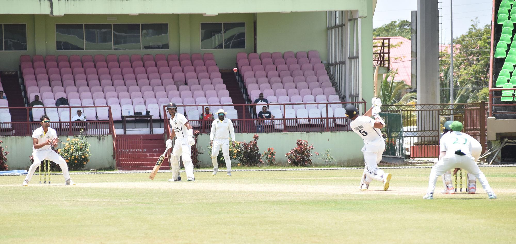 Tagenarine Chanderpaul launches Abhijai Mansingh to the long-on boundary during his innings of 89.