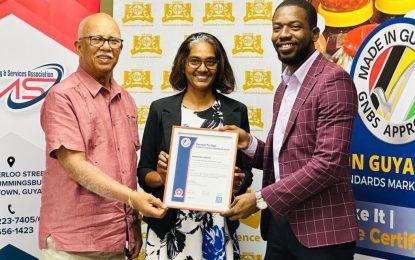 Banks DIH Ltd., Floor IT Guyana receive GNBS Made In Guyana Standard Certification