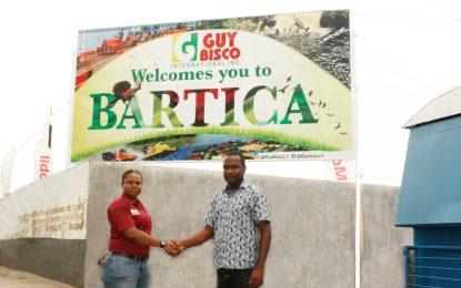 Guybisco hands over welcome billboard to Bartica