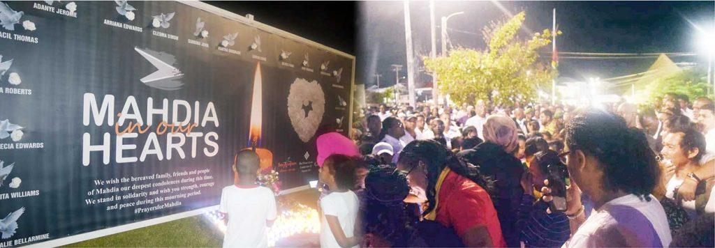 Guyanese paid tribute to the 19 victims of the MahdiaSecondary School dormitory fire on Tuesday night at the
Umana Yana where a candle light vigil was held.