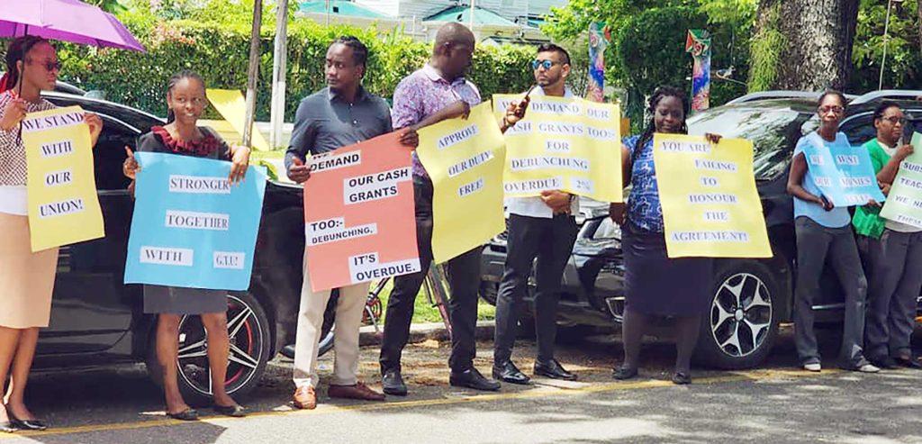 Teachers and representatives of the Guyana Teacher’s Union protesting on Tuesday in front of the Ministry of Finance.