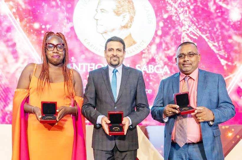 Three laureates from left: Joanne C. Hillhouse – Author from Antigua and Barbuda, Dr. Adesh Sirjusingh – Director of Women’s Health at the Ministry of Health, and Dr. Mahendra Persaud – Chief Scientist at the Guyana Rice Development Board.