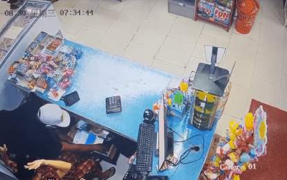 Gunmen rob Chinese supermarket of cash and phone cards