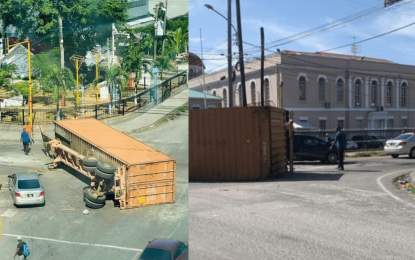 Container slips off truck