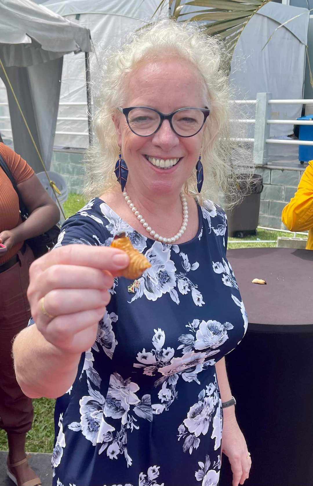 British High Commissioner to Guyana, Jane Miller tries the Tacuma worm. (Credit: British High Commissioner to Guyana. Jane Miller)