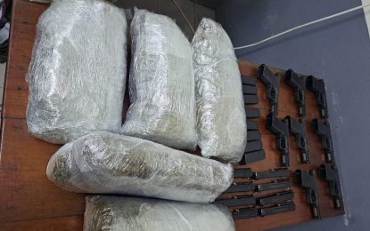 Eight guns, ammo, drugs found in barrel at CJIA